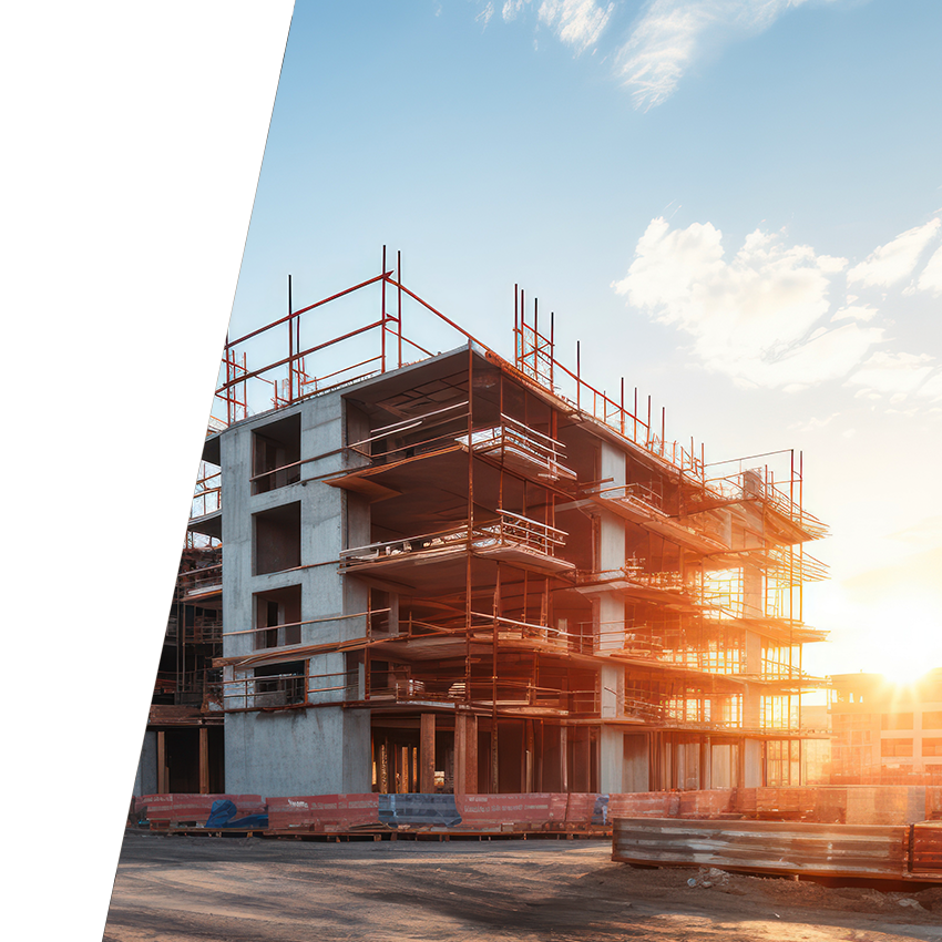 Five story building being constructed with concrete stairwells and steel.